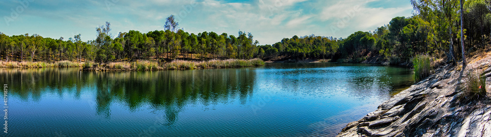 Panoramic mountain lake with clouds