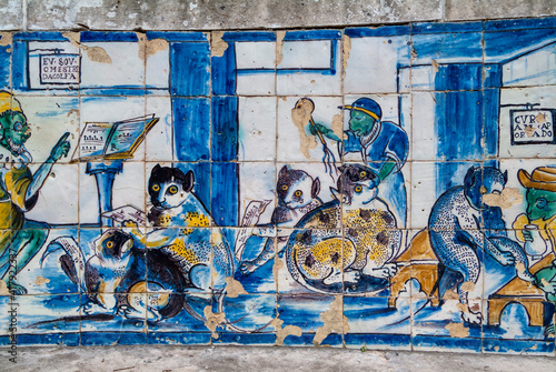 etail of old azulejos showing musician and barber cats in the palace of the Marquis de Fronteira in Lisbon, Portugal photo