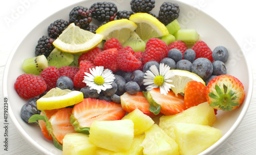 delicious fruit salad with fresh strawberry,kiwi,blackberry,pineapple and raspberry