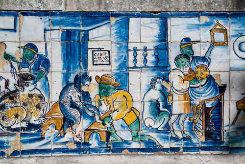 etail of old azulejos showing musician and barber cats in the palace of the Marquis de Fronteira in Lisbon, Portugal photo