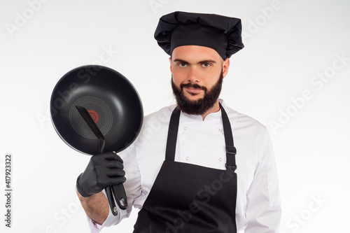 The bearded chef smiles at ...