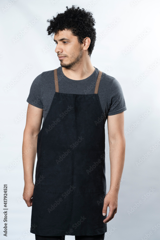 Black Apron Mockup - Hispanic Young Man Wearing Apron Smiling on White Background - Young Worker Black Apron Mockup - Hispanic Young Man Wearing Apron Smiling on White Background - Young Worker