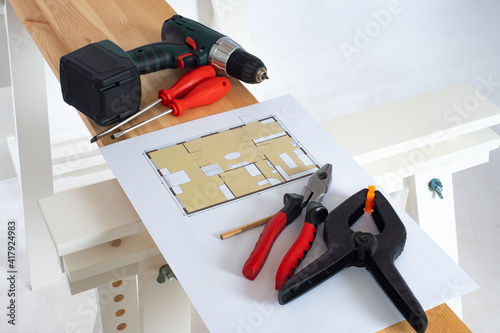 Wallpaper Mural The plan of the apartment and hand tools for repair. Carpentry work in construction. The drawing of the room is on the boards. Finishing works in the room. The design of the apartments. Torontodigital.ca