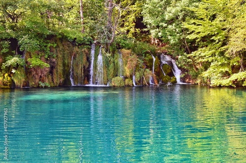 Croatian National Park Plitvice lakes. Majestic view on waterfall with turquoise water and karst cascading lakes