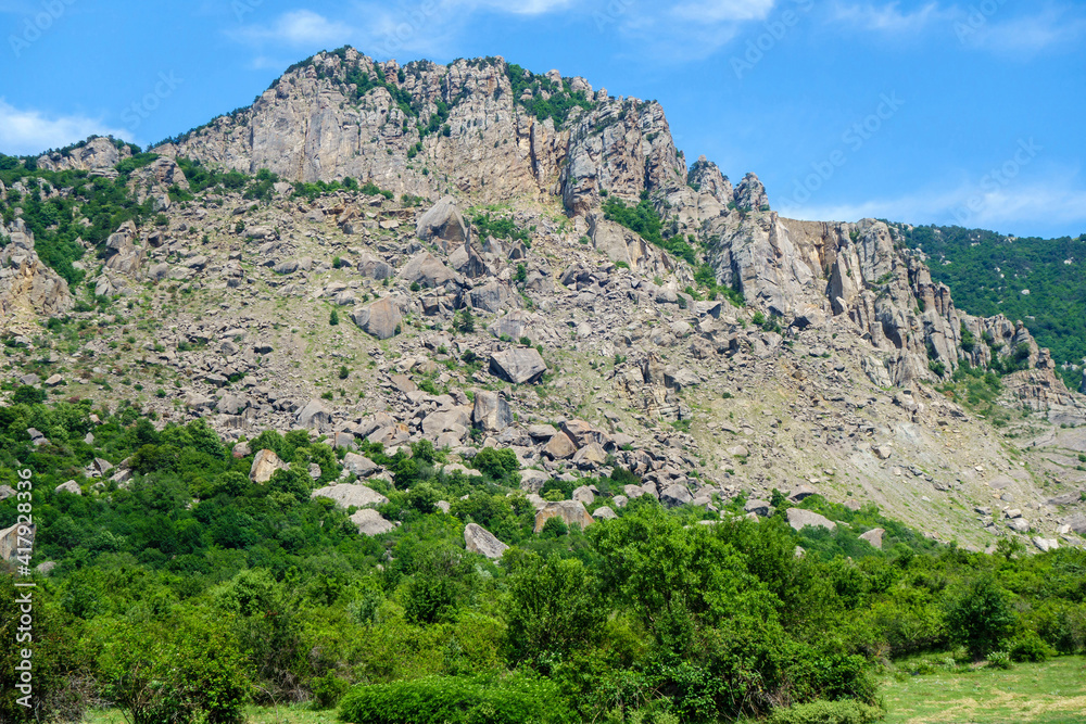 Panorama of mountains in Valley of Ghosts, near Alushta, Crimea. In central part of photo possible to see multi-ton boulders that collapsed as a result of weathering & earthquakes Panorama of mountains in Valley of Ghosts, near Alushta, Crimea. In central part of photo possible to see multi-ton boulders that collapsed as a result of weathering & earthquakes