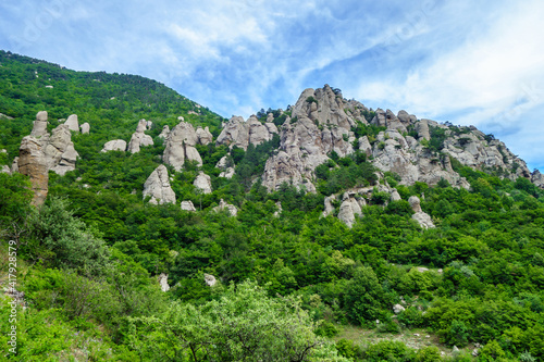 Panorama of mountains & stone erosion columns in Valley of Ghosts, near Alushta, Crimea. These shapes were created by many ages of weathering. One of popular tourist places for hiking