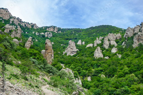 Panorama of mountains & stand alone rocks (so called erosion columns) in Valley of Ghosts, near Alushta, Crimea. This is popular tourist place for hiking photo