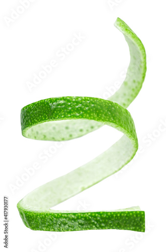 Peel of green lime. Vertical image of lime skin isolated on a white background.