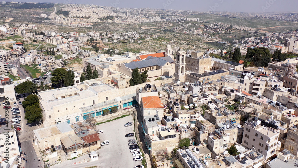 Arial view over Church of the Nativity And City Square Of Bethlehem
, Morning shot from Bethlehem, the town where Jesus was born. Place of The Church of the Nativity
