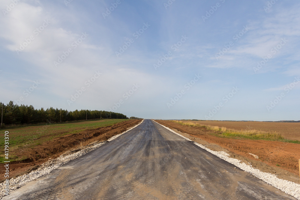 Construction of a new road. Construction stage. Road pavement layers. The composition of the road during its construction