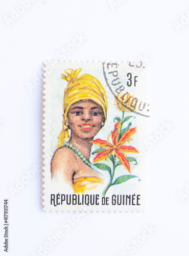 Guinea Republic Postage Stamp. circa 1966. "guinean flora and female headdresses "