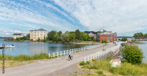 Finland. Helsinki .Panorama on the island of Suomenlinna with a bridge and buildings and water on the sea . photo