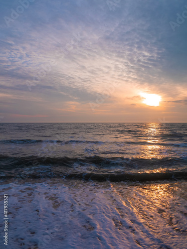 Empty beach with blue sea sunset sky background.South scenic landscape wallpaper, summer vacation season. Vivid blue water with blurred copy space. Resorts advertising