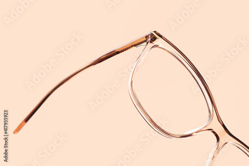 eyewear spectacles close up isolated on beige background photo