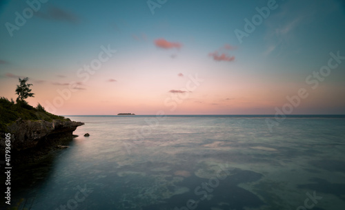 beautiful sunset over the sea. tropical mnemba island in the background. Zanzibar, Tanzania