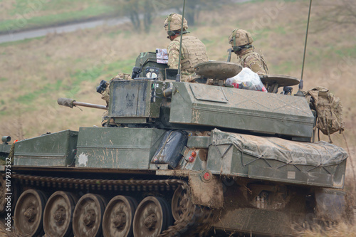 british army FV101 scorpion light infantry fighting vehicle tank on a military exercise, Wiltshire UK