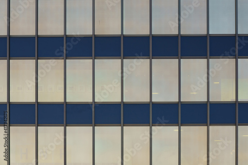 Wallpaper Mural Parallel lines intersect perpendicularly and divide the windows of a modern building. Rectangular panels. Torontodigital.ca