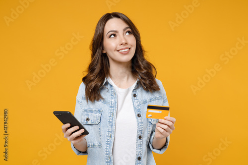 Quadro su tela Young happy brunette dreamful wistful rich woman 20s wearing denim shirt white t