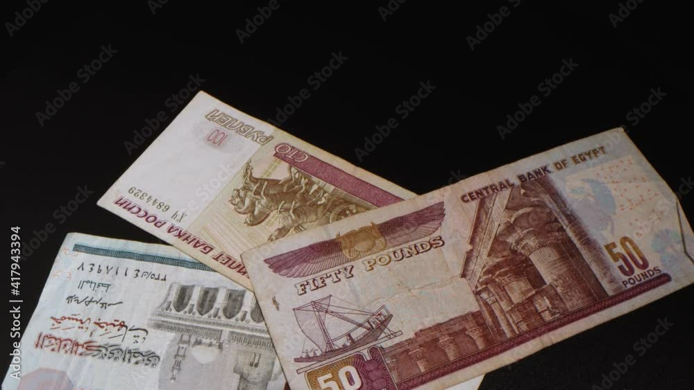 Macro money bills dollars 4K. Dirhams, crown, rupees, pounds, ruble, Swiss francs, zloty, Euro. Banknotes of different countries and denominations Macro money bills dollars 4K. Dirhams, crown, rupees, pounds, ruble, Swiss francs, zloty, Euro. Banknotes of different countries and denominations