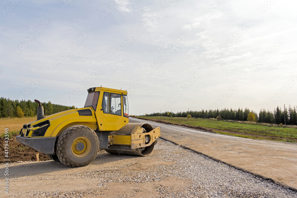 Road Roller on the construction of a new road. Construction machinery. Dedicated Construction machinery for handling bulk materials