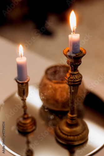 atmospheric candle decor with live fire on the banquet table © omelnickiy