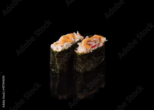 Spicy Gunkan maki sushi with crab meat, black background