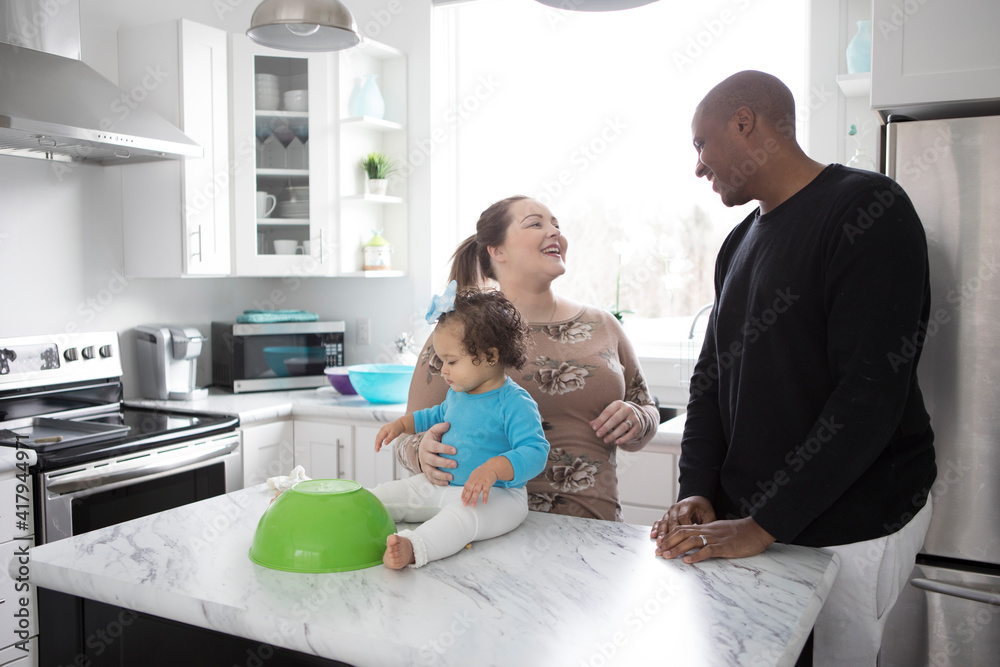 Interracial Family in a Modern Kitchen