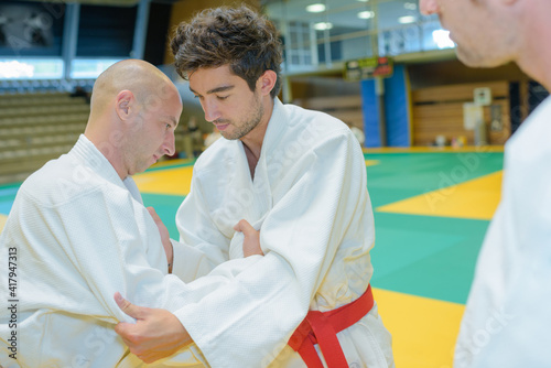 Two men competing at judo