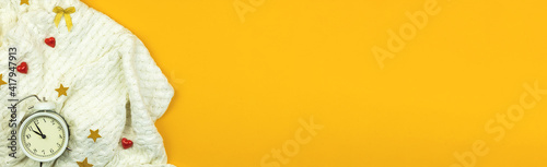Beauty and fashion blog concept, banner, cozy flat lay yellow background with sweater and accessories, copy space