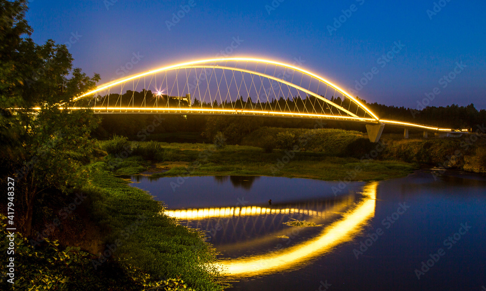Double arch footbridge at sunset  from Salem Riverfront park to Minto Island, Oregon.