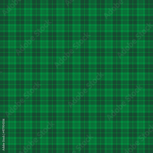 St. Patricks day tartan plaid. Scottish pattern in green and dark green cage. Scottish cage. Traditional Scottish checkered background. Seamless fabric texture. Vector illustration
