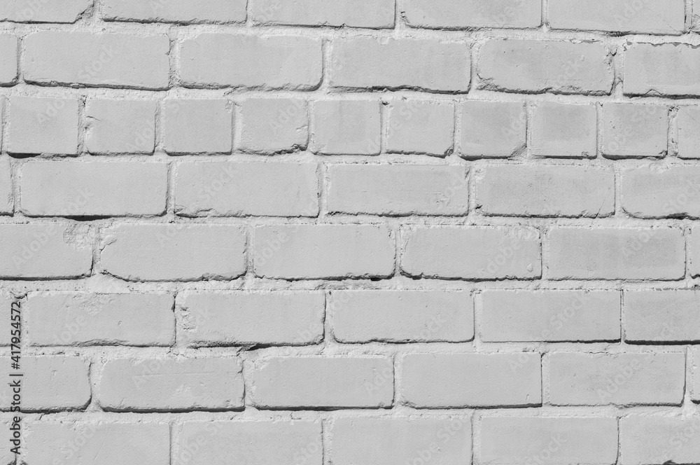 Obraz premium Light gray brick wall. Textured background. Natural light
