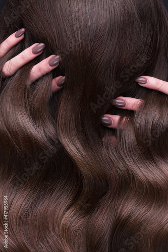 Принти на полотні A closeup view of a bunch of shiny curls brown hair