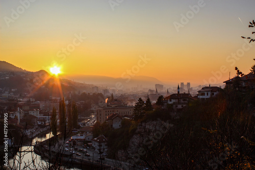 Beautiful sunset over Sarajevo and Sarajevo City Hall. Beautiful view of the city and the silhouettes of other sights of the city of Sarajevo. photo