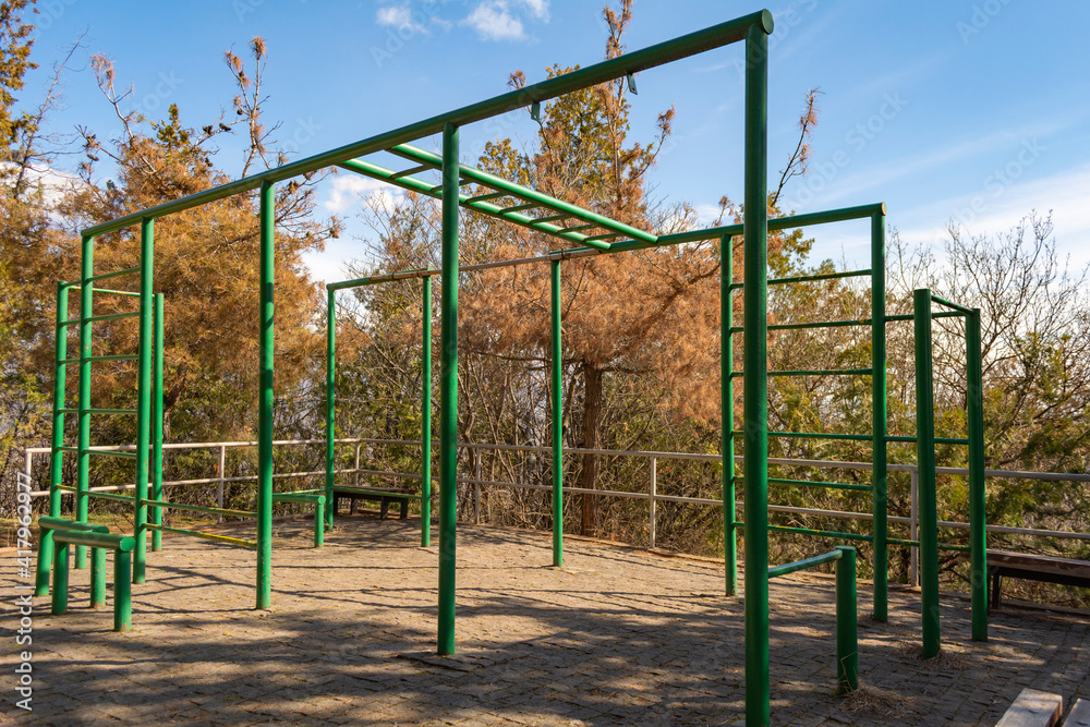 Playground in a public park. Positive emotions, spring sunny day. Playground in a public park. Positive emotions, spring sunny day.