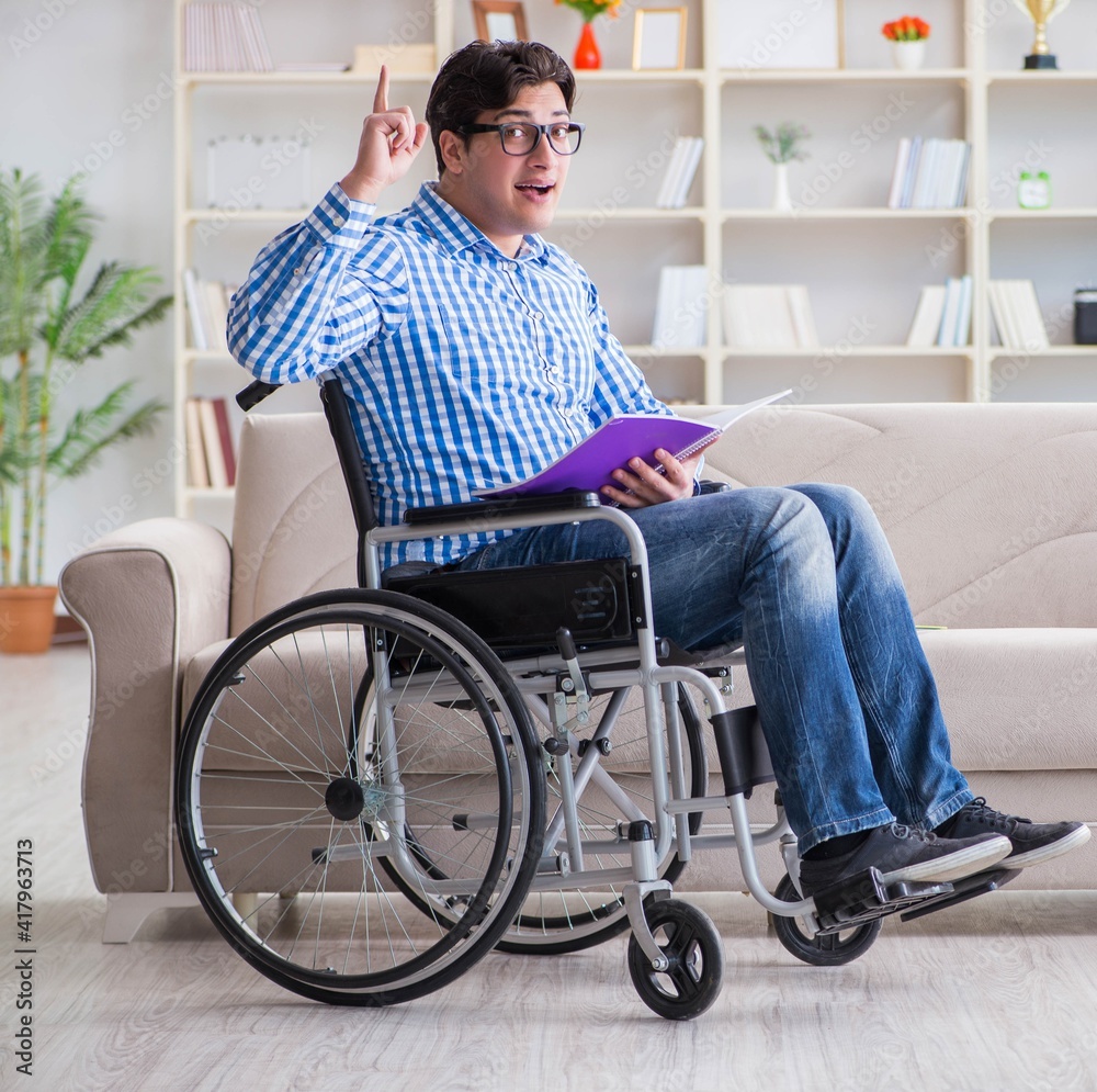 Young student on wheelchair in disability concept Young student on wheelchair in disability concept