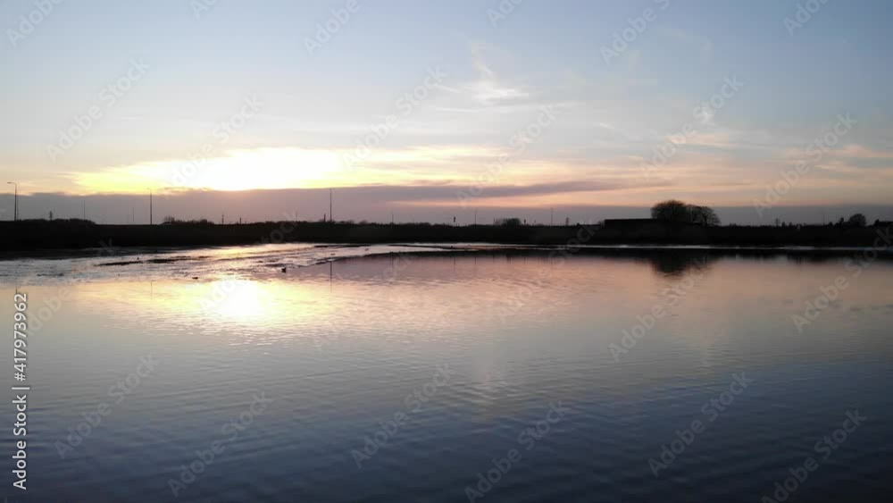 Reflections On Calm Lake At Crezeepolder Near Village Of Ridderkerk In The Netherlands During Sunrise. - Aerial Drone Shot Reflections On Calm Lake At Crezeepolder Near Village Of Ridderkerk In The Netherlands During Sunrise. - Aerial Drone Shot