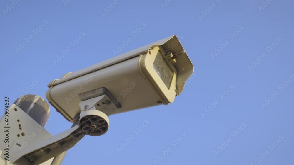 Security camera cctv video surveillance mounted on extremity steel pole and clear blue sky background, Old cctv cameras on to the top pillar on sunny day, Electronic camera monitor record,
handheld. Security camera cctv video surveillance mounted on extremity steel pole and clear blue sky background, Old cctv cameras on to the top pillar on sunny day, Electronic camera monitor record,
handheld.