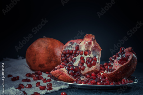 Beautiful pomegranate on dark background.