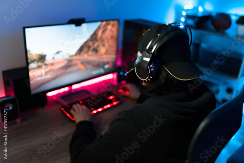 Hispanic man having fun and enjoying a videogame