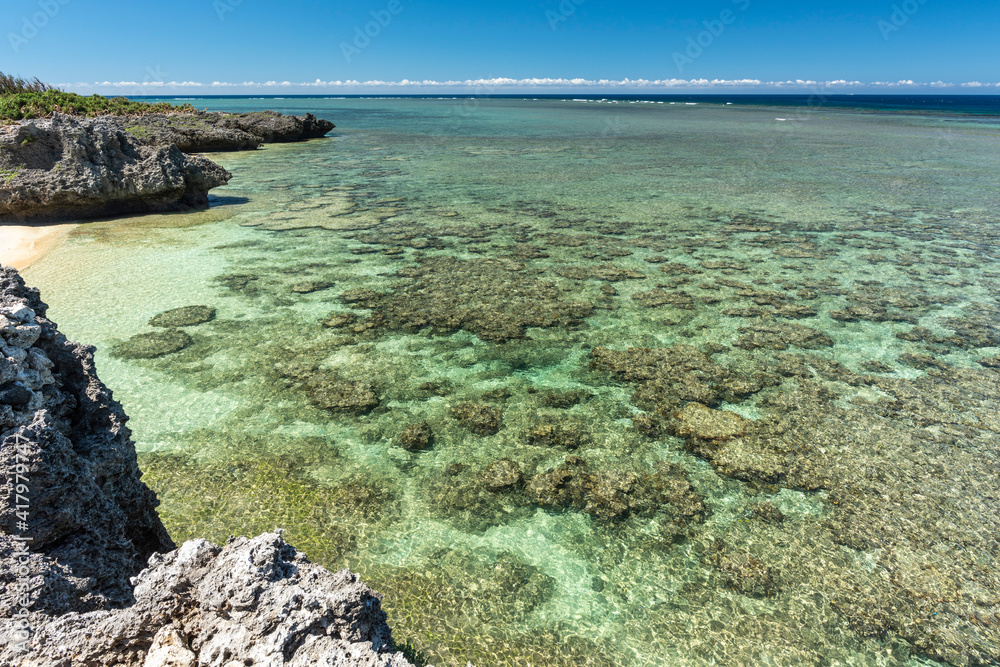 View of an attractive beach close to the reef with a highly transparent water,  Shimanakahama, Japan.