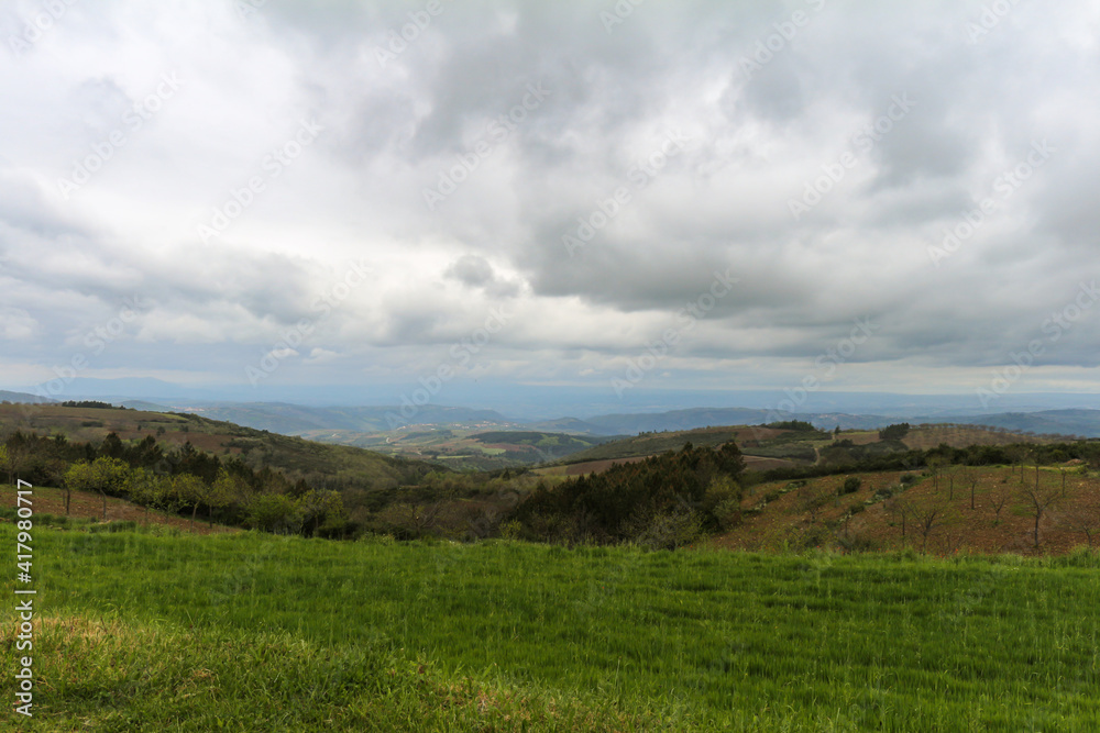 Beautiful valley of Italian Tuscany during a cloudy day. Beautiful valley of Italian Tuscany during a cloudy day.