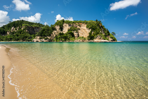 Fototapeta Naklejka Na Ścianę i Meble -  Calm sea at Tudumarihama beach, emerald green sea, blue sky, perfect for relaxing time Iriomote Island.