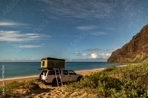 overland truck camper on beach illuminated Milky Way photo