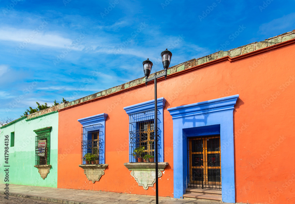 Oaxaca, Mexico, Scenic old city streets and colorful colonial buildings in historic city center. Oaxaca, Mexico, Scenic old city streets and colorful colonial buildings in historic city center.