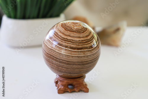 Sphere aragonite on a stand. Large ball of aragonite. photo