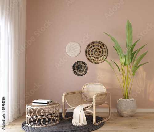 home interior with rattan armchair ,book on rattan coffee table ,green plant ,black carpet , cream color  fabric and wood frame,cozy home decorate,wall pink color.