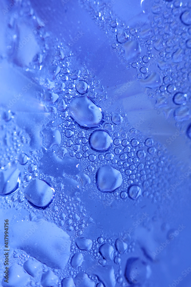 Macro shooting of water droplets beside the glass surface close up liquid drops modern background pattern high quality print Macro shooting of water droplets beside the glass surface close up liquid drops modern background pattern high quality print