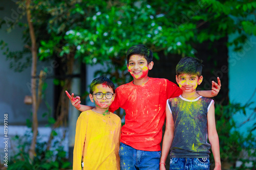 Cute indian little child   s group playing holi. Holi is colors festival in india