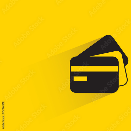 credit cards with shadow on yellow background